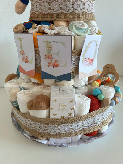 Tarta de Pañales: El Regalo Perfecto para Nuevos Padres

¡Celebra la llegada de un nuevo bebé con nuestra encantadora Tarta de Pañales! Esta divertida y práctica creación es el regalo ideal para baby showers, nacimientos o cualquier ocasión especial.

Se pueden personalizar los productos (bodis, calcetines, mordedor, chupetero, productos de higiene y temática de la tarta).